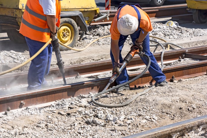 Two Workers with Pneumatic Hammer